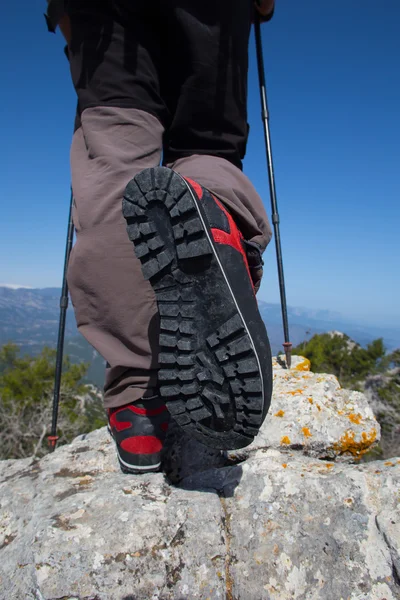 Hiker standing on top of the mountain with valley on the background. — Stock Photo, Image