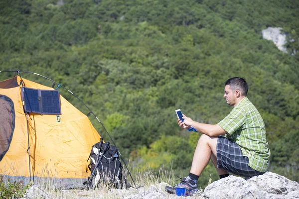 Camping on the mountain top.The solar panel attached to the tent. — Stock Photo, Image