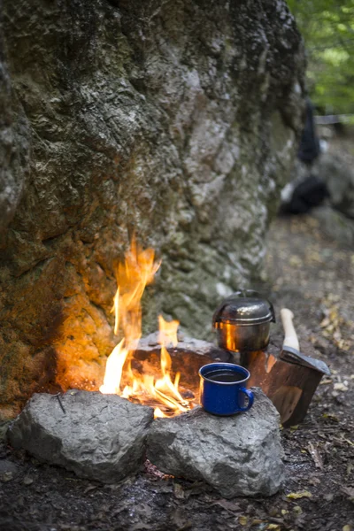 Cooking breakfast.Cooking breakfast on a campfire at a summer camp.