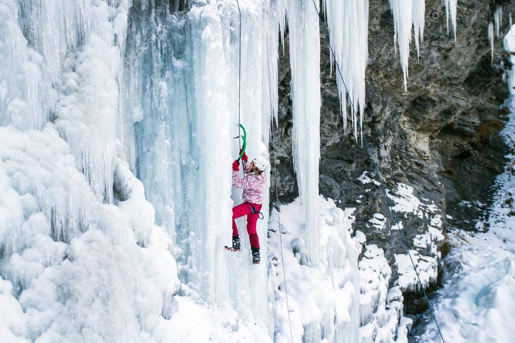 Man climbing frozen waterfall.Ice climbing the North Caucasus.