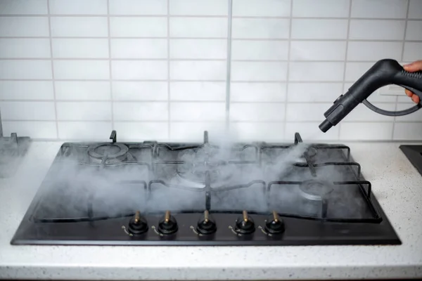 steam disinfection and sanitization of the house, steam treatment of the kitchen gas stove