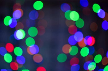 güzel renkli bokeh şenlik arkaplanı koyu arkaplan odağı dışında çok renkli ışıklardan oluşur