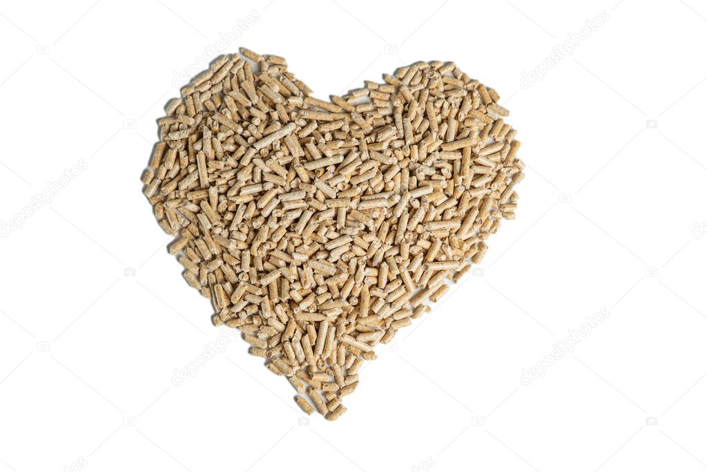 pellets laid out in the shape of a heart on a white background top view