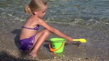 Child Playing on Beach, Kid making Sand Castles, Child on Seashore, Girl in Greece in Summer Vacation