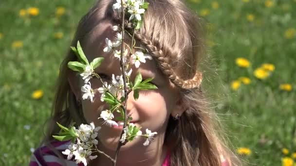 Girl by Spring Blossom Tree in Park, Child Laughing Smiling by Flowers, Happy Young Kid Portrait Laughs — Stock videók