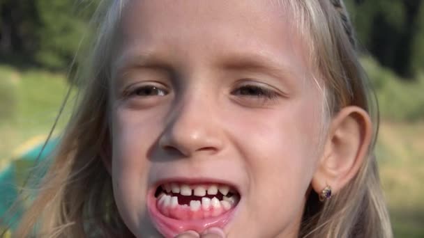 Kid Studying Her Tooth, Child Baby Teeth, Smiling Girl Looking, Make Faces, Playing in Camera, Children Outdoor in Nature — Stock Video