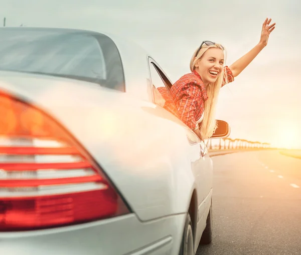 Lady look out from car window — Stock Photo, Image