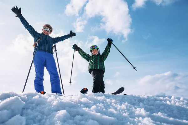 Two skiers standing together on snow hill — Stock Photo, Image