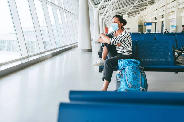 Lonely Female Solo Traveler Backpack Sitting Empty Airport Passenger Transfer — Stock Photo, Image