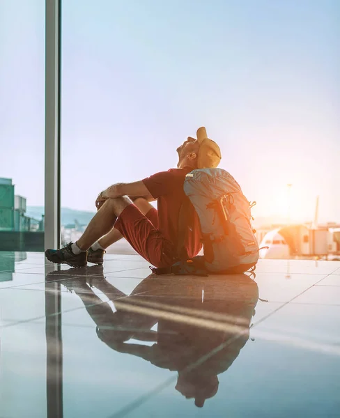 Alone Backpacker Traveler Sitting Airport Terminal Floor Window Looking Hall — Stock Photo, Image