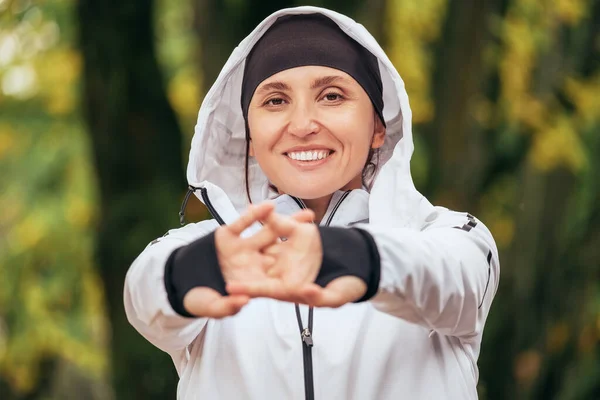 Smiling Fit Athletic Woman Wearing Modern Waterproof Running Jacket Stretching — Stock Photo, Image