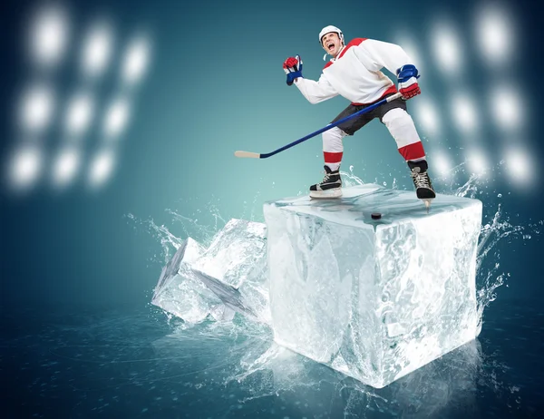 Hockey player on ice cube — Stock Photo, Image