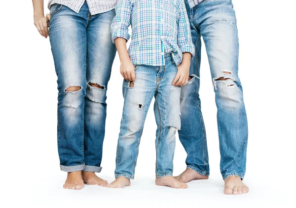 Family legs in tattered jeans — Stock Photo, Image