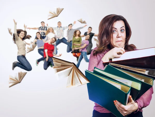 Mad faced teacher with folders — Stock Photo, Image