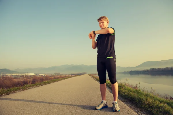 Runner start his watch — Stock Photo, Image