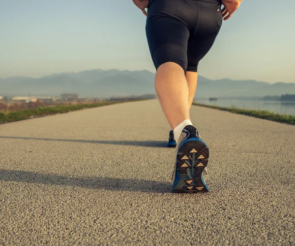 Sprinter warming up legs — Stock Photo, Image