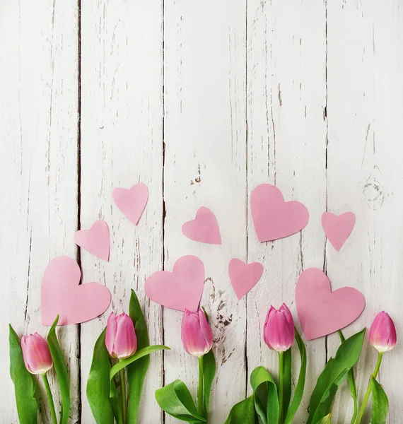 Tulips with pink  hearts — Stock Photo, Image