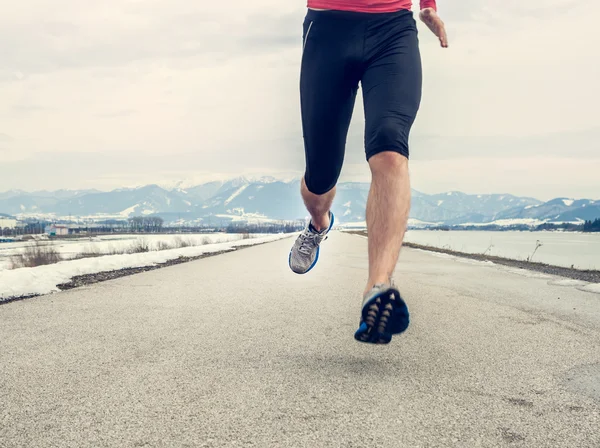 Runner benen op asfalt — Stockfoto
