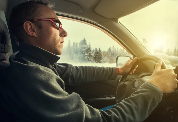 Man drive  car  on winter road — Stock Photo, Image