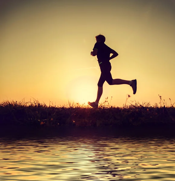 Running man in sunset time — Stock Photo, Image
