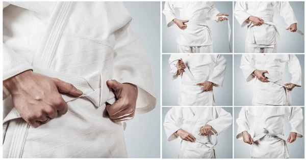 Karateka ベルトを結ぶステップバイ ステップ — ストック写真