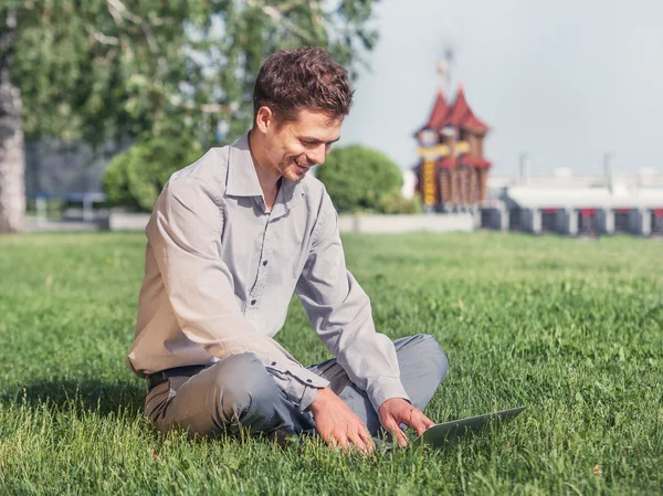 Young man work with laptop — Stock Photo, Image