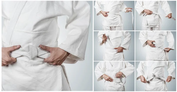 Karateka ベルトを結ぶステップバイ ステップ — ストック写真