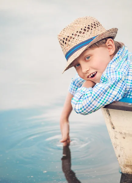 Boy portrait in old boat — Stock Photo, Image