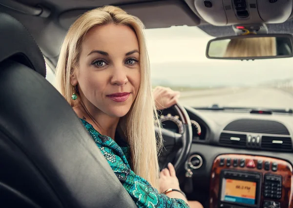 Pretty woman portrait in car — Stock Photo, Image