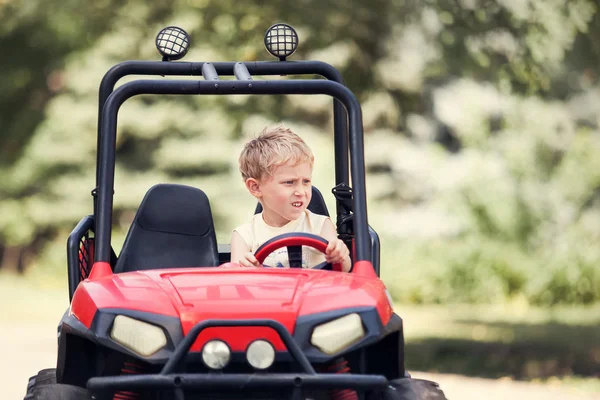 Little boy drive mini electric car — Foto Stock