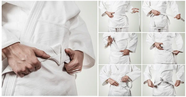 Karateka ベルトを結ぶステップバイ ステップ — ストック写真