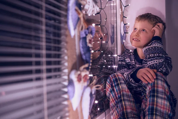 Boy dreaming about Santa presents — Stock Photo, Image