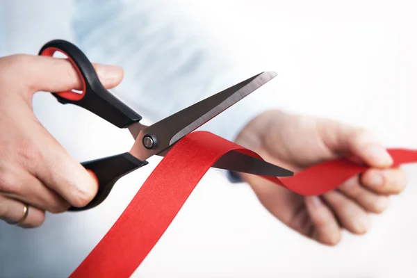 Red ribbon cutting for open new project — Stock Photo, Image