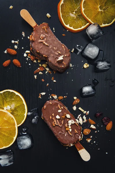 Ice creams in chocolate with almond — Stock Photo, Image