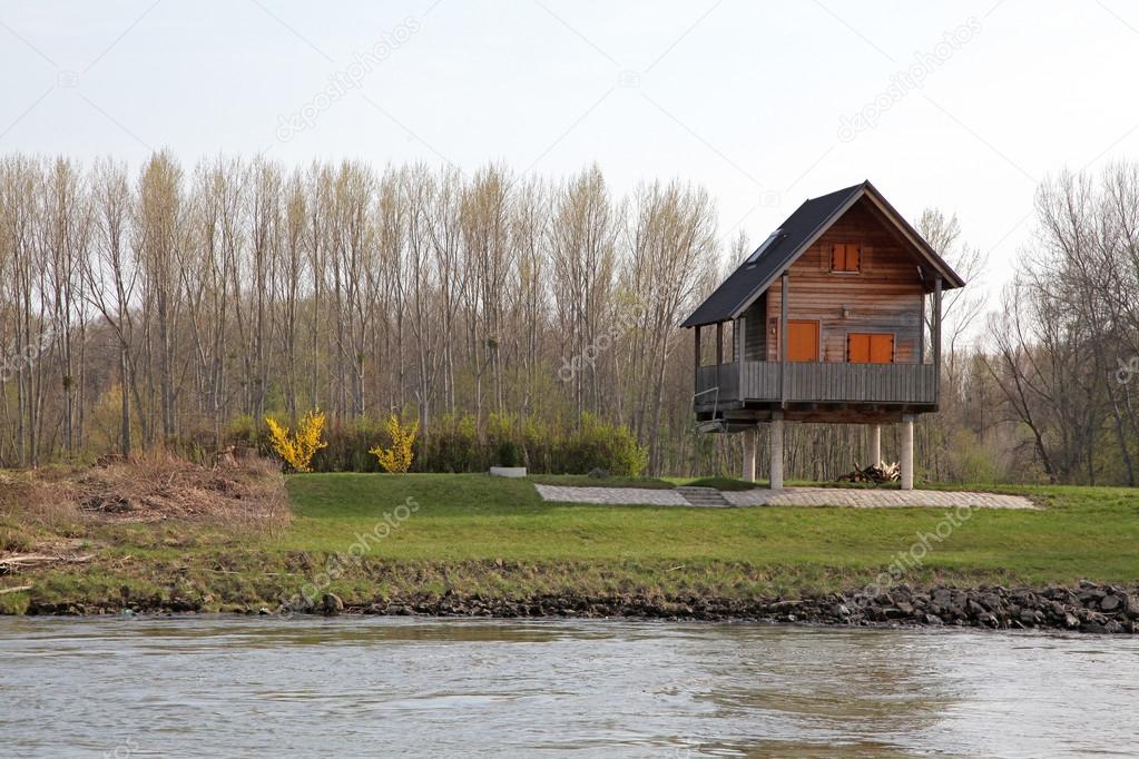House on pylons near river Danube