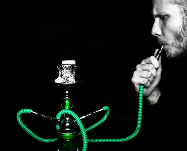 Man smokes a hookah — Stock Photo, Image