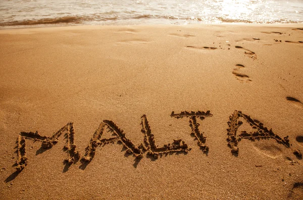 Text Malta på stranden — Stockfoto