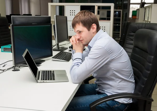 Young handsome man with computer in the office. Programming — Stock Photo, Image