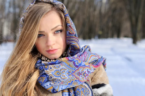 Young beautiful girl with blue eyes posing outdoors — Stock Photo, Image