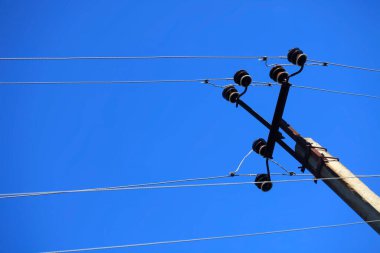 Power grids against a blue sky