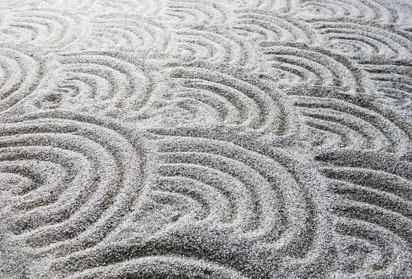 沙子上的花纹是由许多层组成的圆圈 — 图库照片