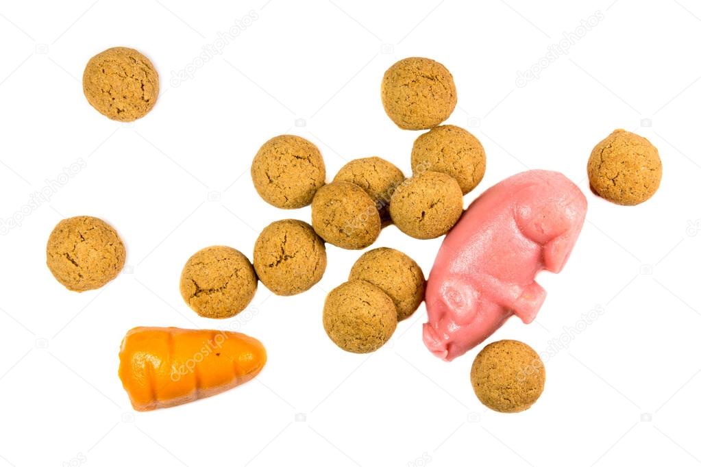 Bunch of Pepernoten cookies with marzipan pig and carrot