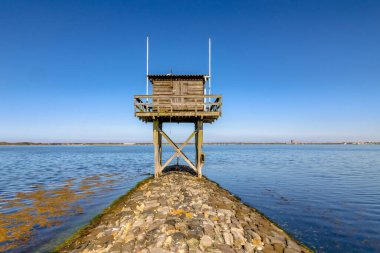 Coastline of Grevelingen brackish inlet in Zeeland Province, the Netherlands. clipart