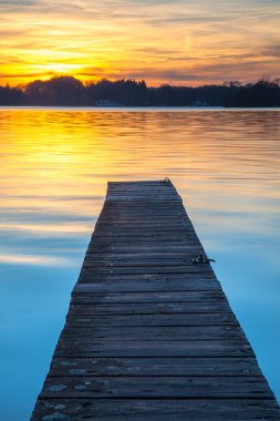 Beautiful Sunset over Wooden Jetty in Groningen, Netherlands clipart