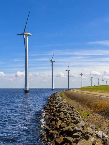 Wind turbines in a long row — Stock Photo, Image