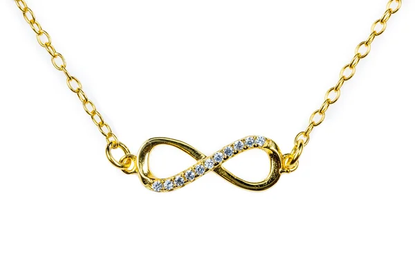 Golden infinity pendant with diamonds — Stock Photo, Image