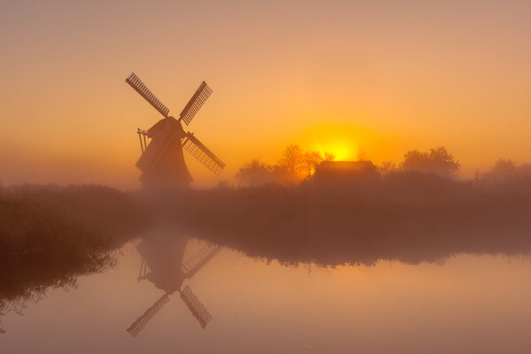Historic windmill along a canal