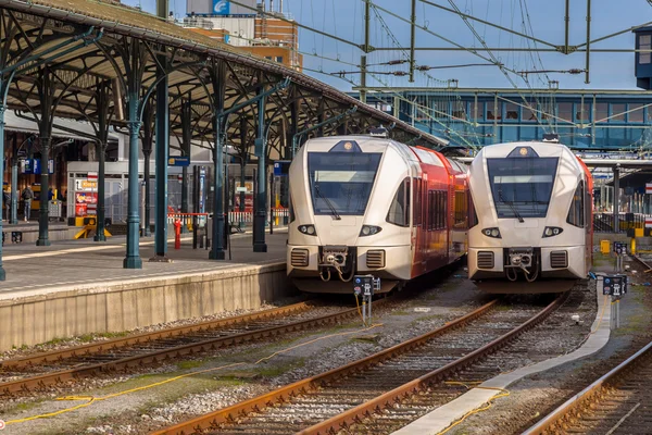 Two modern passenger commuter lightrail trains waiting at Gronin — Stock Photo, Image