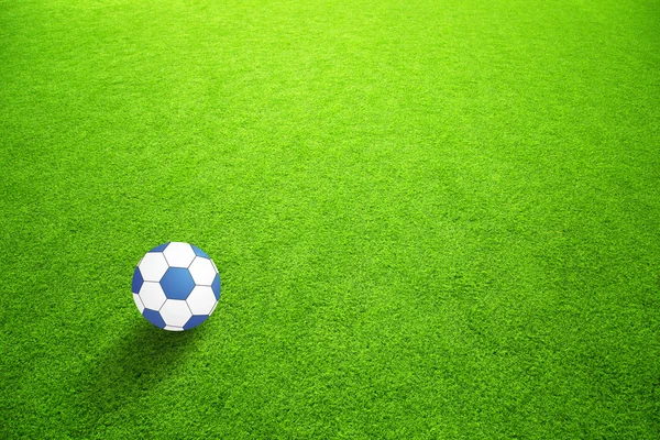 Artificial green grass with blue ball — Stock Photo, Image