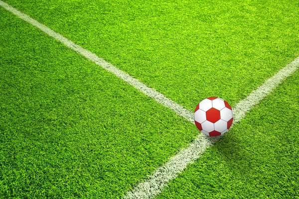 Soccer field with red ball — Stock Photo, Image